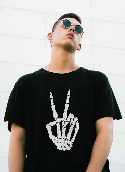 Man wearing a skull peace sign hand t-shirt